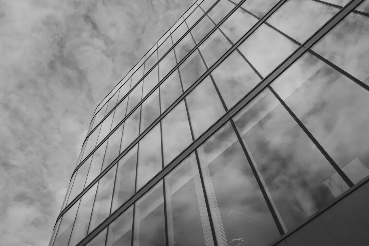 Clouds reflected in a glass building facade