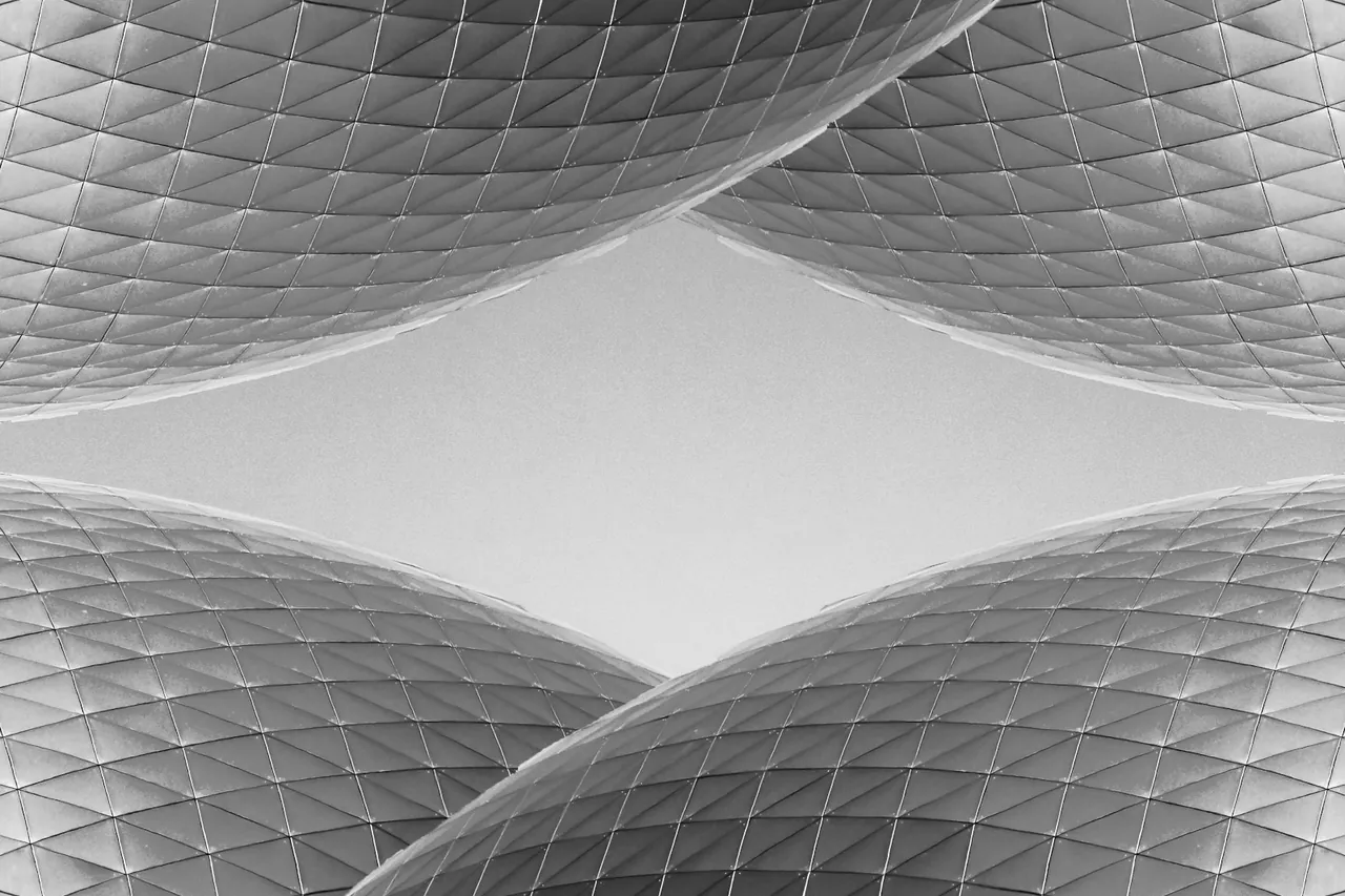 Geometric building surfaces framing the sky